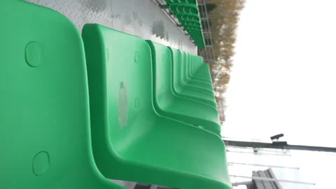 Circular motion reveals rows of damp glossy chairs Stock Footage 316756120