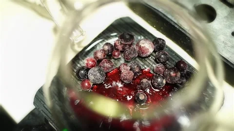 Circular Pan over Berry and Cherry Syrup Infusion in Glass Teapot Stock Footage 312262535
