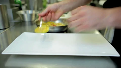 Circular Pasta Being Arranged on a White Plate by a Chef Stock Footage 36052208