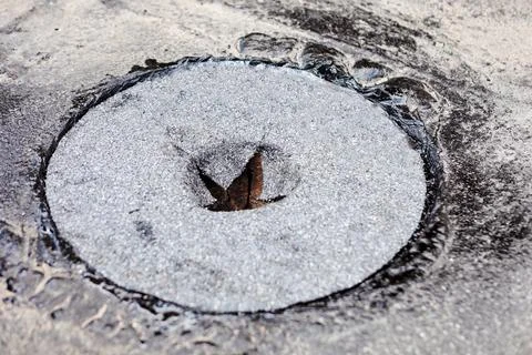 Circular patch of roofing felt Stock Photos