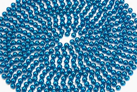 Circular pattern of string of blue beads Stock Photos