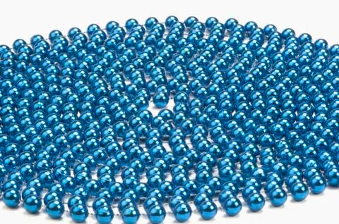 Circular pattern of string of blue beads Stock Photos
