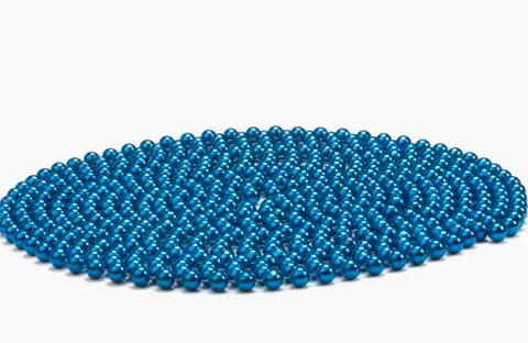 Circular pattern of string of blue beads Stock Photos
