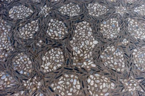 Circular patterns on a stone walking path at the Alhambra palace in Granada,  Stock Photos