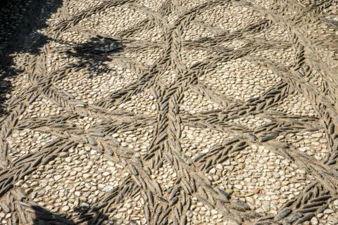 Circular patterns on a stone walking path at the Alhambra palace in Granada,  Stock Photos