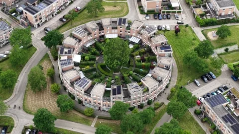 Circular residential building complex with rooftop solar panels 스톡 동영상 343100000