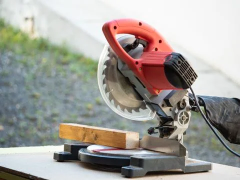 Circular Saw. Carpenter Using Circular Saw for wood beam Stock Photos