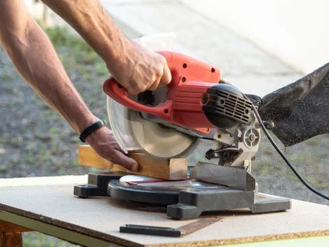 Circular Saw. Carpenter Using Circular Saw for wood beam Stock Photos
