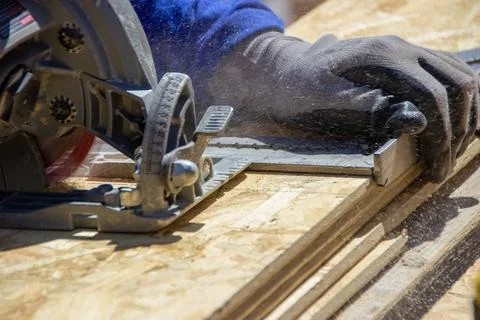Circular saw construction worker Stock Photos