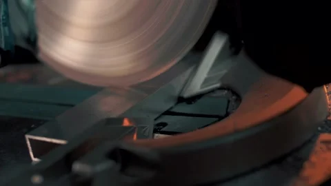 Circular saw cuts metal structures like butter. Close-up. Slow motion Stock Footage 179708538