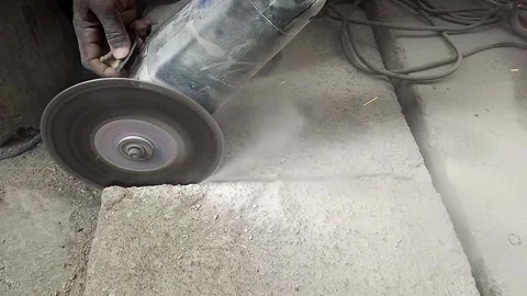 CIRCULAR SAW CUTTING CONCRETE Stock Footage 165184743