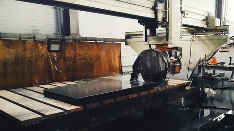 Circular saw cutting of Huge stone block. Granite processing in manufacturing. Video stock 106448724