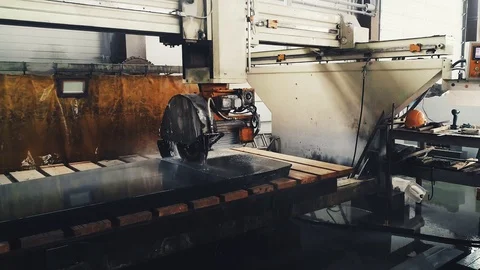 Circular saw cutting of Huge stone block. Granite processing in manufacturing. Video stock 106448796