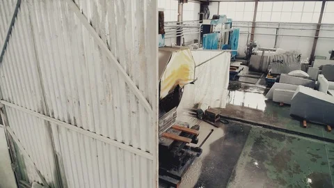 Circular saw cutting of Huge stone block. Granite processing in manufacturing. Video stock 106452706