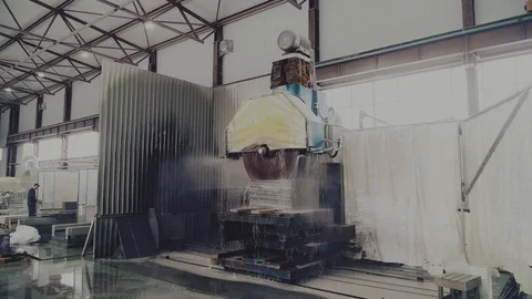 Circular saw cutting of Huge stone block. Granite processing in manufacturing. Video stock 106452747