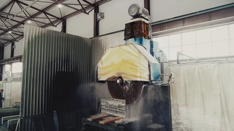 Circular saw cutting of Huge stone block. Granite processing in manufacturing. Video stock 106452777