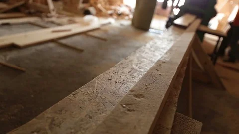 Circular saw cutting through a plank of wood Stock Footage 80145405