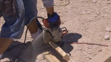 Circular saw cutting wood in construction site  Stock Footage 86128227