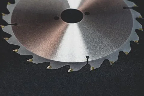 Circular saw disk on a black background. circular saw blade on wood Stock Photos