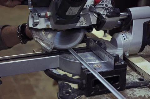 Circular Saw. Man Using Circular Saw for Metal Corner. Stock Photos