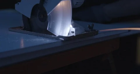 Circular saw, saw at night, power-saw in dark with light Stock Footage
