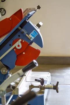 The circular saw stands in the window ready for use. Stock Photos