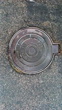 Circular Sewer Cover Stock Photos