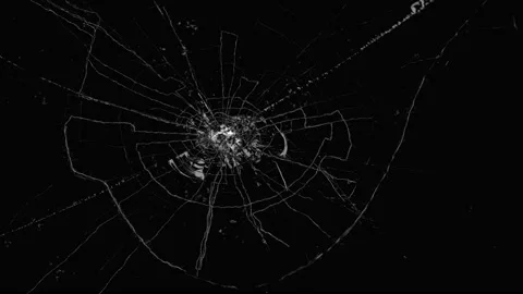 Circular shattered glass crack effect on black background Stock Footage 337209078
