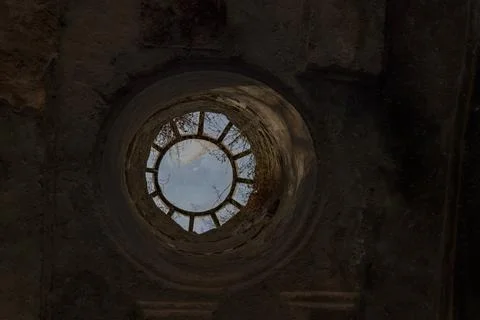Circular skylight window in old stone church ceiling Stock Photos