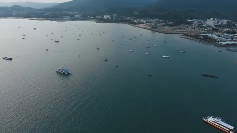 Circular span of a drone over a bay in the city of Kuah. Stock Footage 106811026