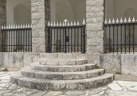Circular steps leading up to a gate Stock Photos