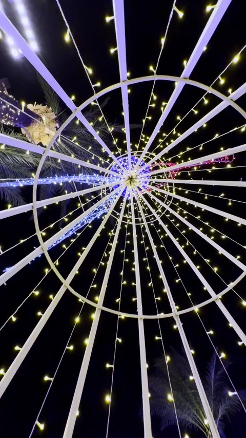 Circular structure with glowing string lights at night Stock Footage 321195932