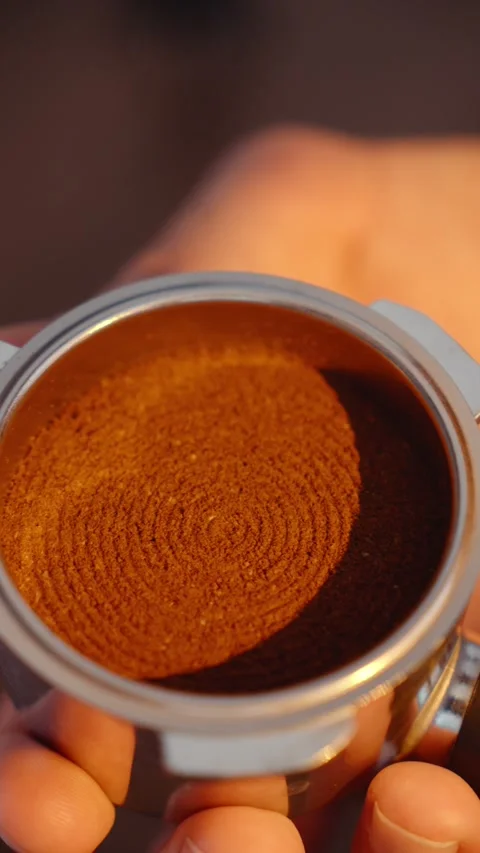 Circular Tamping Pattern on Ground Coffee in Espresso Portafilter Stock Footage 347067201