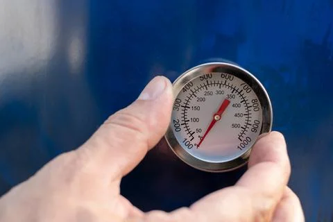 Circular Temperature gauge thermometer mounting installation process in for m Stock Photos