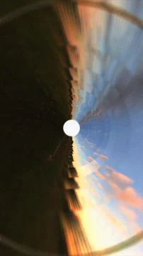 Circular tunnel vision distorted sunset sky reflection Stock Illustration