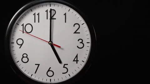 Circular wall clock ticking towards 5 o'clock, with copy space Stock Footage 60827527