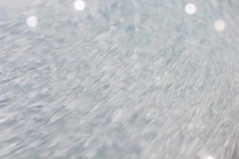 Circular wave motion in a fluid system. blue gray background for a liquid pus Stock Photos