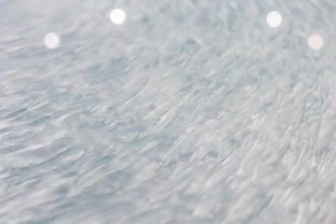 Circular wave motion in a fluid system. blue gray background for a liquid pus Foto stock