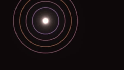 Circular waves radiate from a light source on dark Stock Footage 338235345