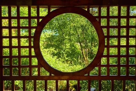 Circular Window View of Lush Green Garden Pavilion in Gresham 写真素材