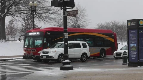 The Circulator bus runs in the wintertime in Washington, DC Stock Footage 147630688