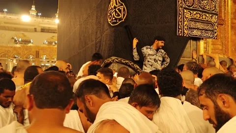 Circumambulating around the Kaaba, crowding around the Black Stone. Mecca, Saudi Stock Footage 255485449