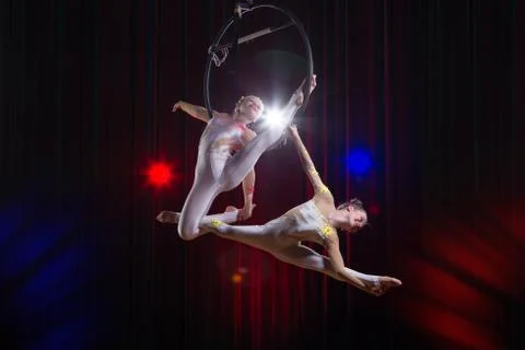 Circus actress acrobat performance. Two girls perform acrobatic elements in the Stock Photos