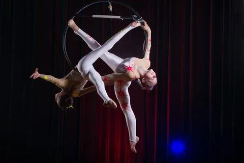  Circus actress acrobat performance. Two girls perform acrobatic elements ... Stock Photos