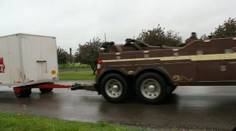 Circus cars being pulled through town 動画素材 723929