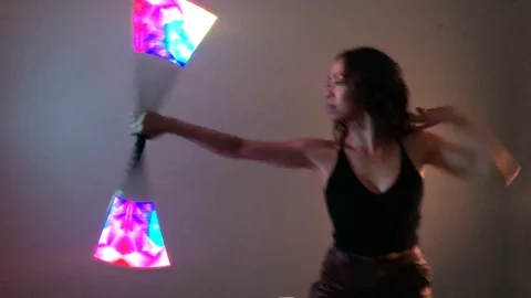 Circus Performer Dancer Spinning LED Visual Staff Light Sticks Video stock 128088019