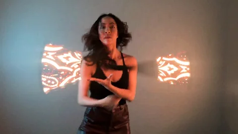 Circus Performer Dancer Spinning LED Visual Staff Light Sticks Video stock 128088102