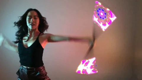Circus Performer Dancer Spinning LED Visual Staff Light Sticks Video stock 128088449