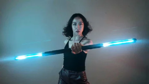 Circus Performer Dancer Spinning LED Visual Staff Light Sticks Video stock 128088527