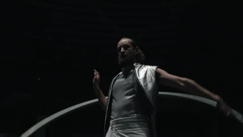 A circus performer spins Sir's wheel around him in the arena. Stock Footage 168373734